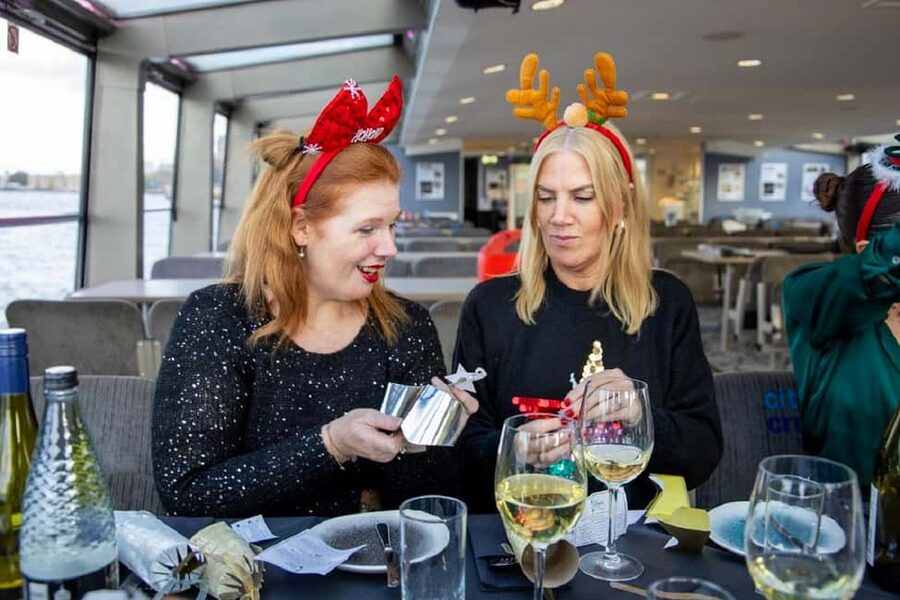 Festive London Christmas Day River Thames Lunch Cruise - A welcome glass before the river views begin