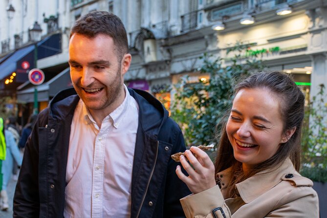 Paris Christmas Food Tour with a Local Guide, and Seasonal Treats - Browsing the Notre-Dame Christmas market