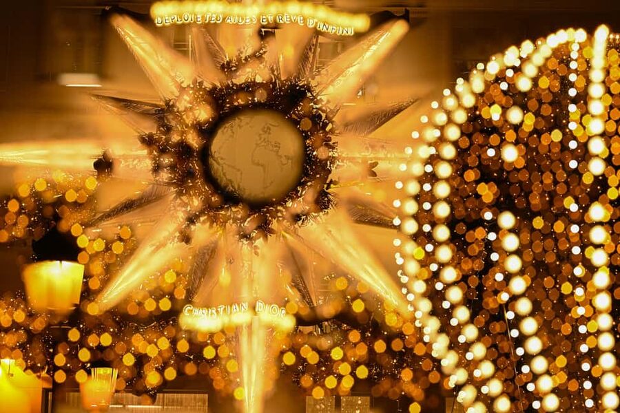 Paris: Experience the magic of Christmas on a walk with a pro photographer - Meeting Marc at the Flame of Liberty