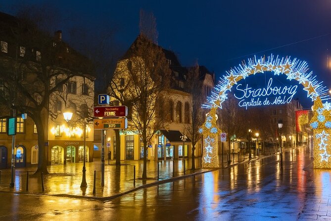 Strasbourg Christmas Magic Self Guided Walking Tour with an APP - Red light curtains and the Capital of Christmas arch